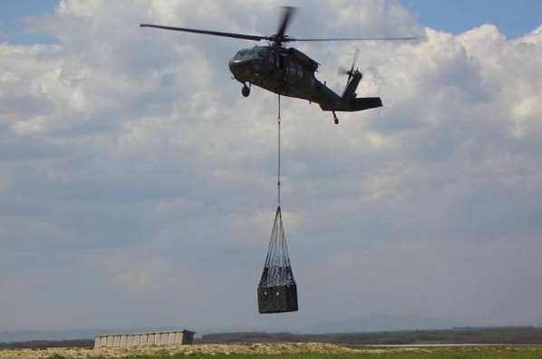 Helicopter based deployment of greenfield site telecommunications.